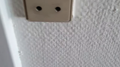 light switch plate on the wall near light switch