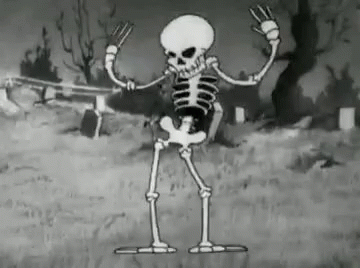 skeleton cartoon with a cat on his shoulders standing in a graveyard