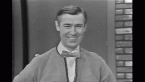 an old black and white po of a man with a bow tie