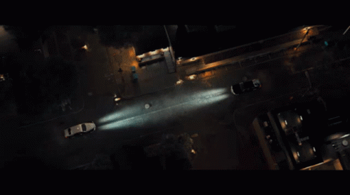 an aerial view of a night time traffic and vehicles