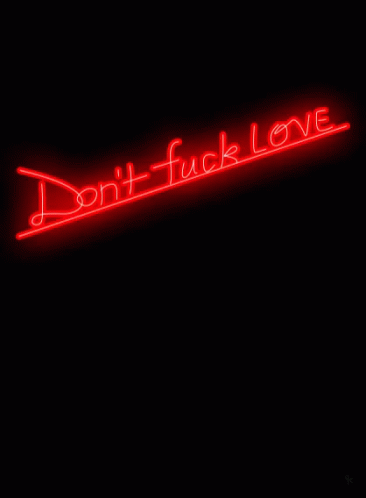 a neon sign reads don't tuck love