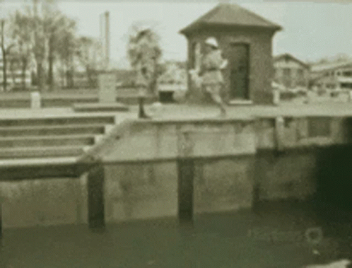 this is the docks with two people sitting and a person looking at them