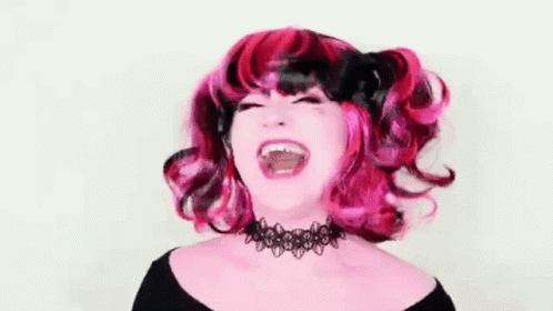 an image of a woman with purple hair laughing