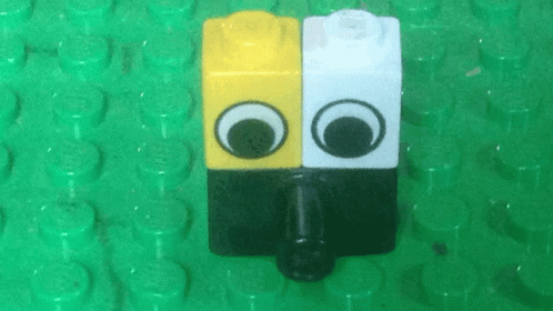 a couple of cute looking faces are in the shape of lego