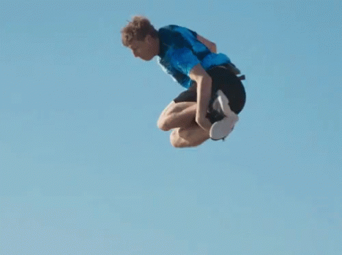 a person is doing a flip on a skateboard