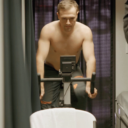 a man is working on an exercise machine
