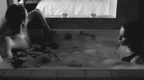 people are taking a bath in an open tub