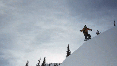 person snowboarding on top of a ski slope