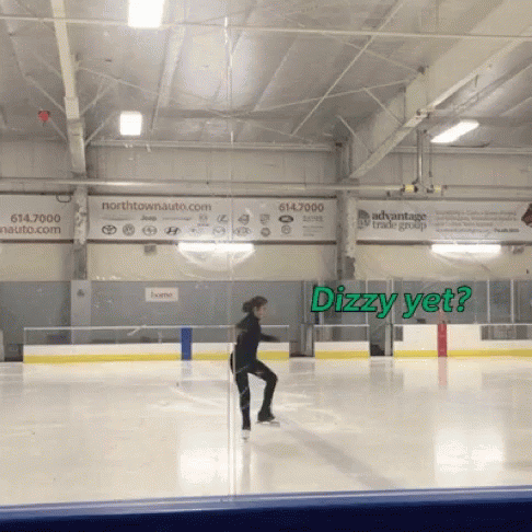 a skateboarder skating on a large indoor rink