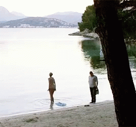 two guys standing in the middle of a lake
