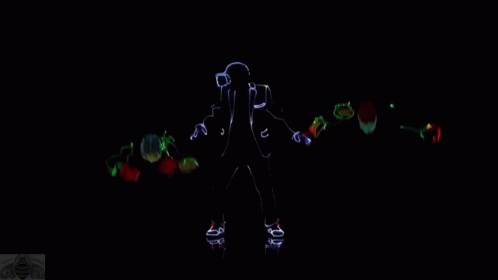 a dark background with a figure lit up in the center