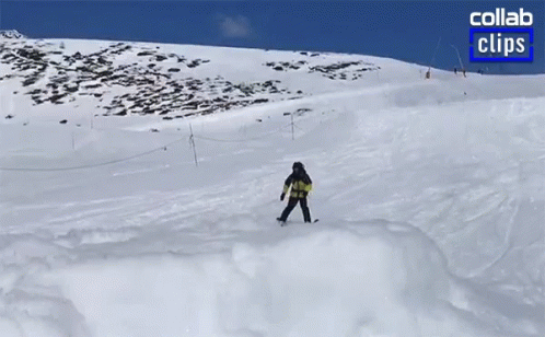 snowboarder on slope of a steep slope covered in snow