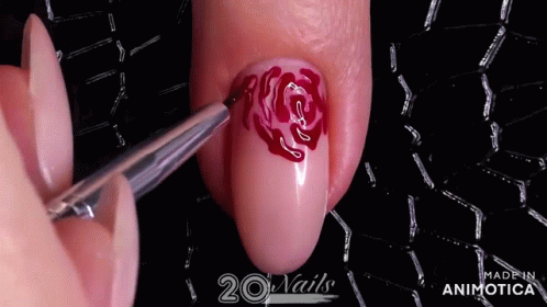 there is a large blue nail with a rose on it
