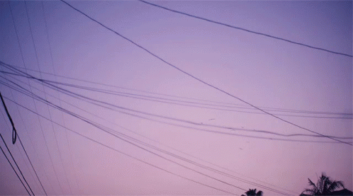 this is an image of a building with wires in the sky