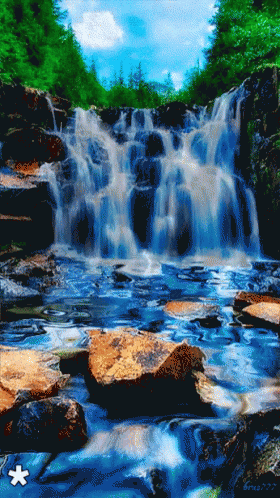 a waterfall is shown in the middle of some rocks