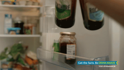 a close up view of a fridge with drinks