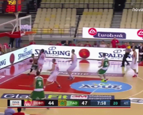 the basketball players are playing on a court