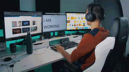 person with headset at the computer on the desk