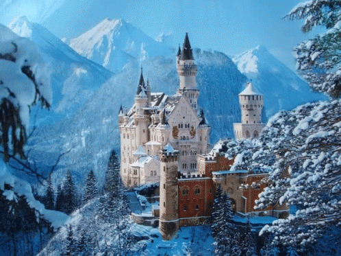the castle is surrounded by snow covered mountains