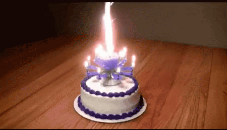 a cake with candles in the form of a spider