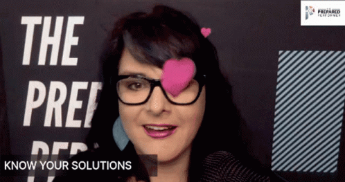 a woman with fake heart shaped eyeballs is talking on an iphone
