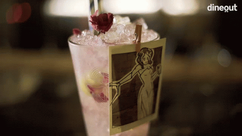 a po of a woman with flowers is put on a drink