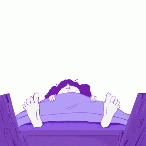 a girl lying down on the end of a bed
