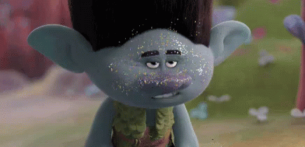 an animated cartoon character dressed as a troll, looking over his shoulder