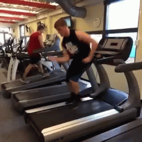 a man doing soing on a stationary bike