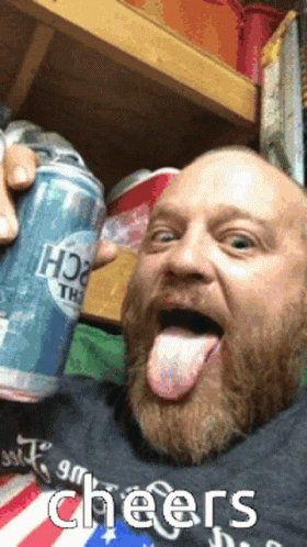 a guy that is licking a canned drink