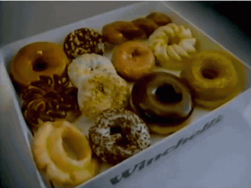 a box with donuts that are blue and white in them