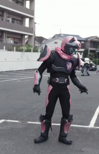 an image of man in cosplay costume standing in parking lot