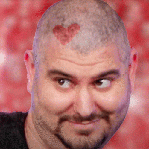 a bald man is making a face with heart shapes on his head