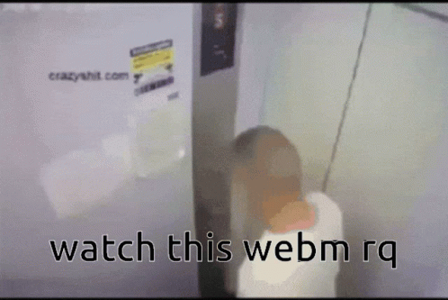 blurry image of a white bathroom with the text watch this webm