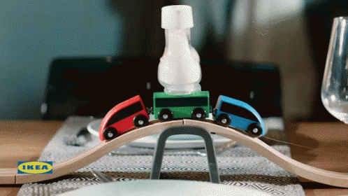 the toy train is on the track with the bottle