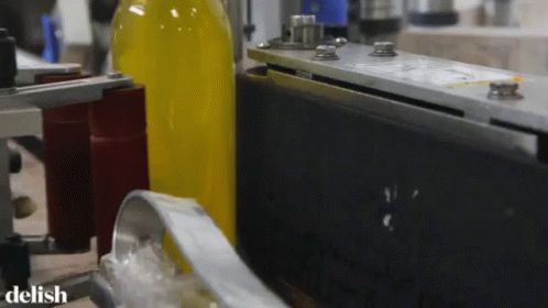 an automatic water bottle being assembled in a factory