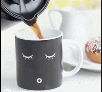 a cup with a spoon sticking out of it