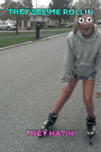 a person riding roller skates down a street