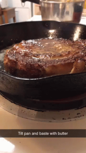 a frying pan with a small cake in it