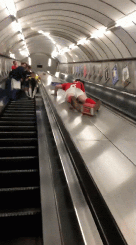 people are moving down the stairs in an indoor station
