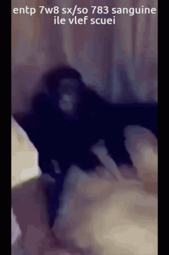 a blurry image of a person on a bed