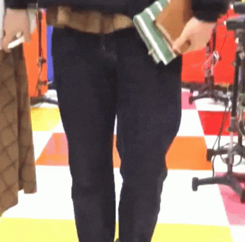 a man carrying his luggage through the store floor