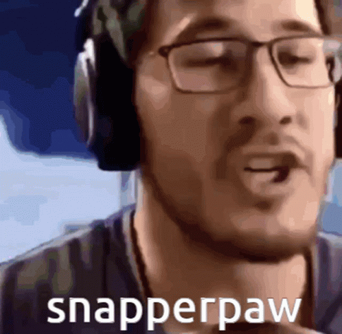 a man wearing headphones looking into the distance with a text reading snapperpaw