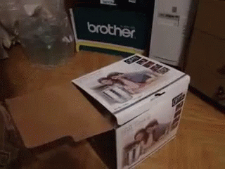 the inside of a magazine rack on a table with other boxes in it