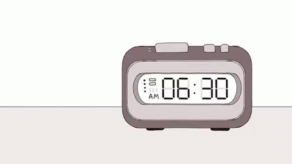an alarm clock on a table with a white background