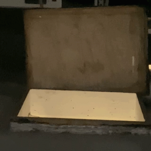 a white box with the lid slightly empty