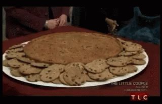 a tray full of cookies sits on a table