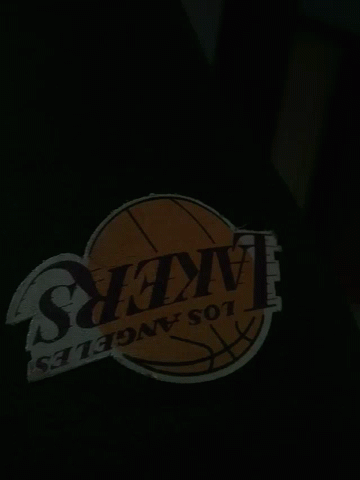 a basketball sticker sits on the jacket of a man