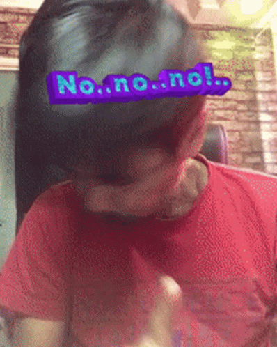a young man wearing a blue t - shirt is behind a fake head with a no - one message taped to it