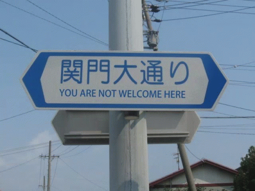 a sign is attached to a pole outside